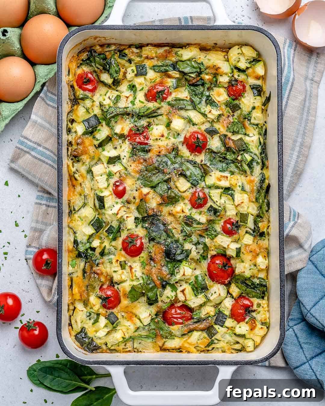 Easy and low carb crustless quiche recipe, golden brown with vibrant vegetables