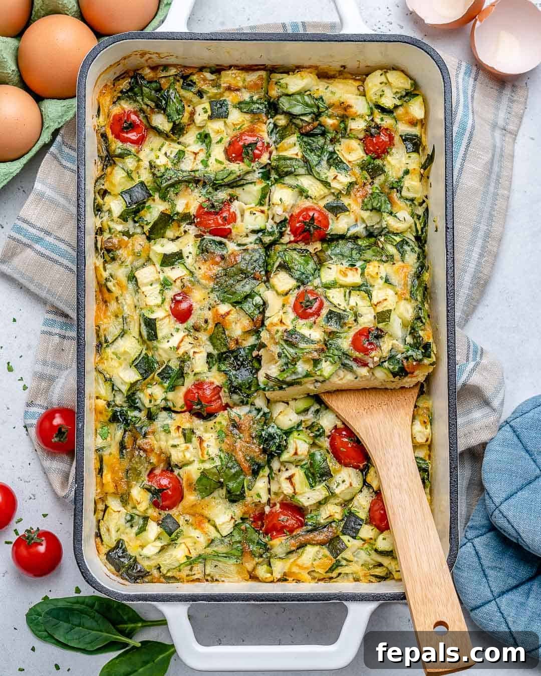 Delicious baked crustless quiche, garnished with fresh herbs and ready to be served.