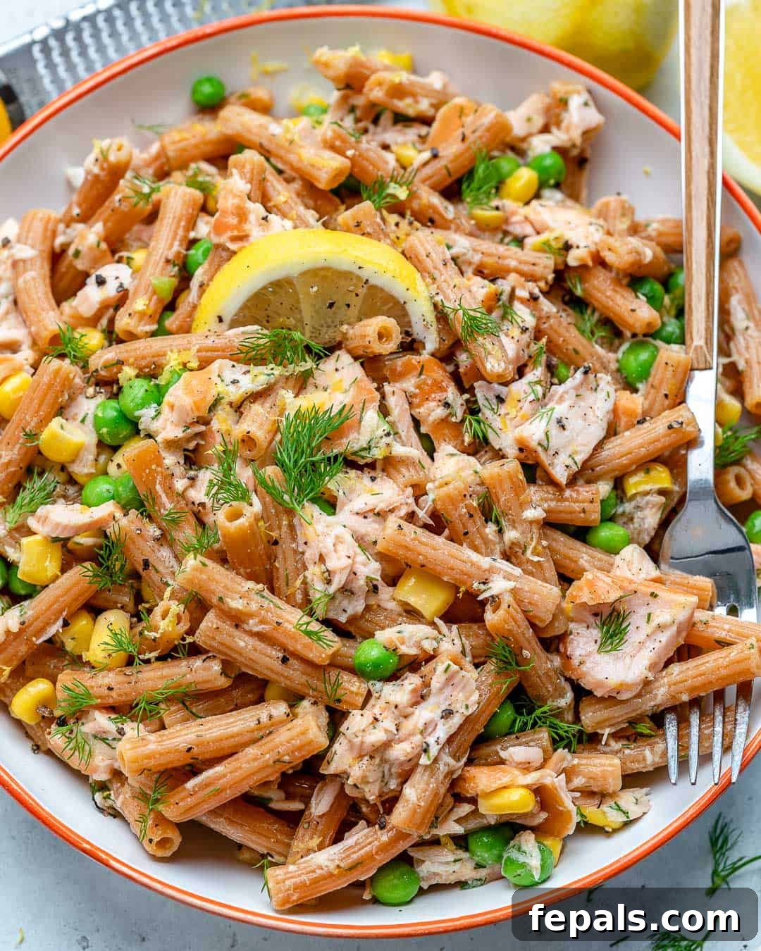 Finished lemon dill salmon pasta salad in a large bowl, ready to serve