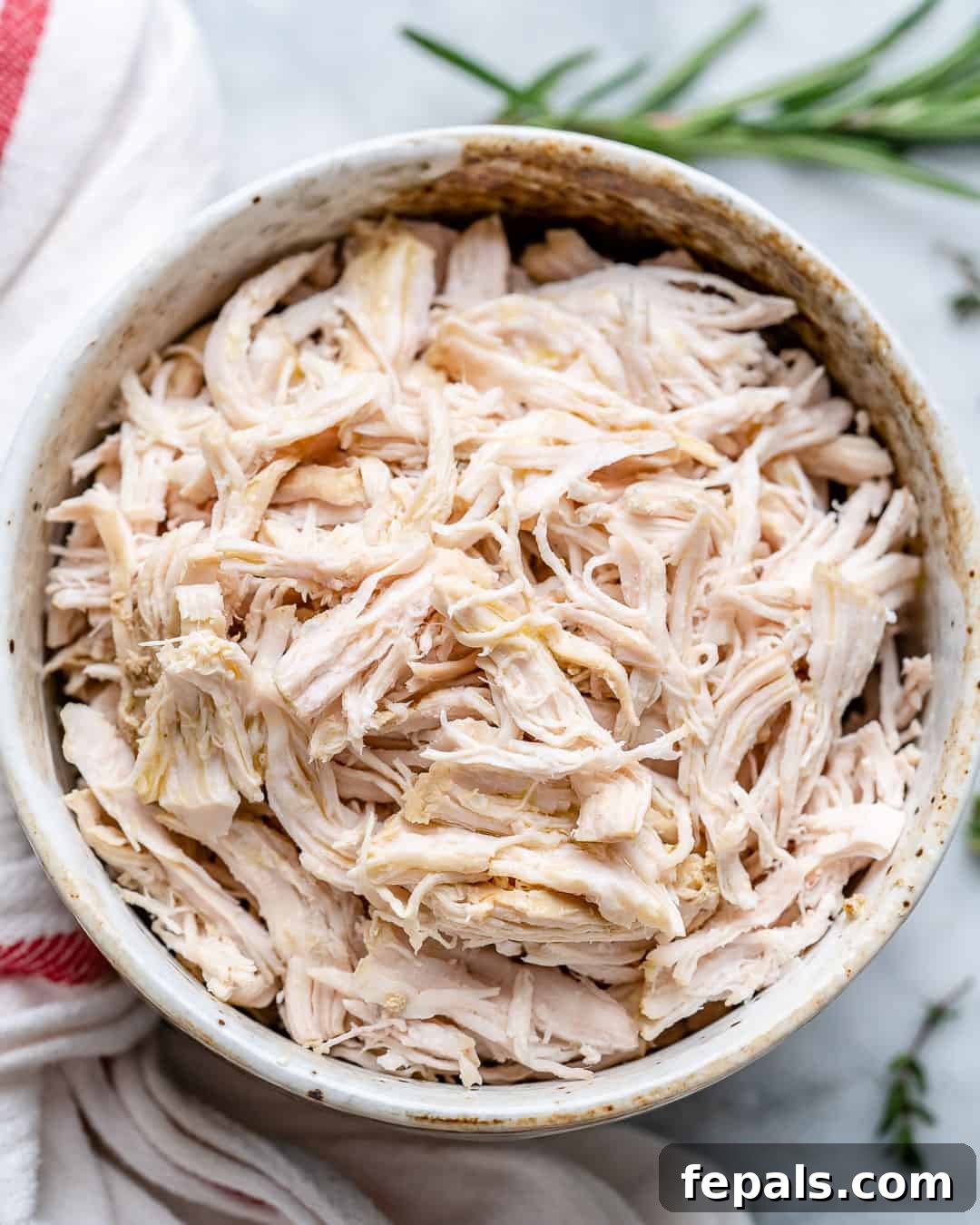 Perfectly Poached Chicken Every Time 10 Poached chicken shredded in bowl