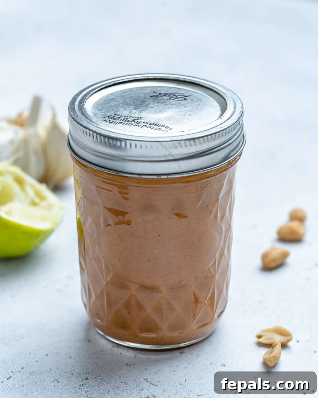 Savory Thai Peanut Sauce 8 Jar of Healthy Thai Peanut Dressing on counter