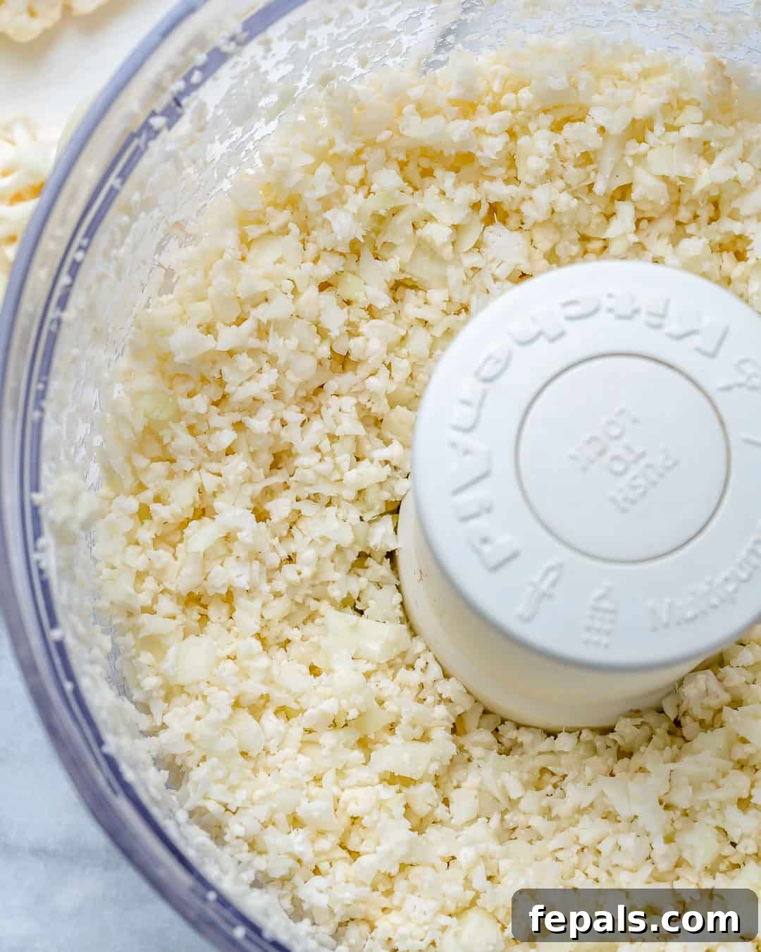Crispy Cauliflower Pizza Crust 5 Pulse in food processor until rice texture is created.