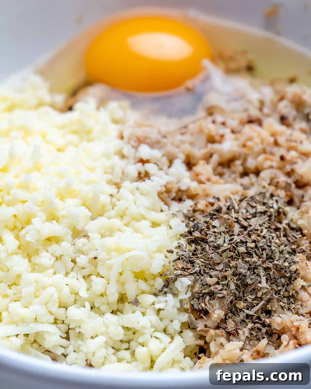 Crispy Cauliflower Pizza Crust 8 Mix cauliflower rice with egg and seasonings.