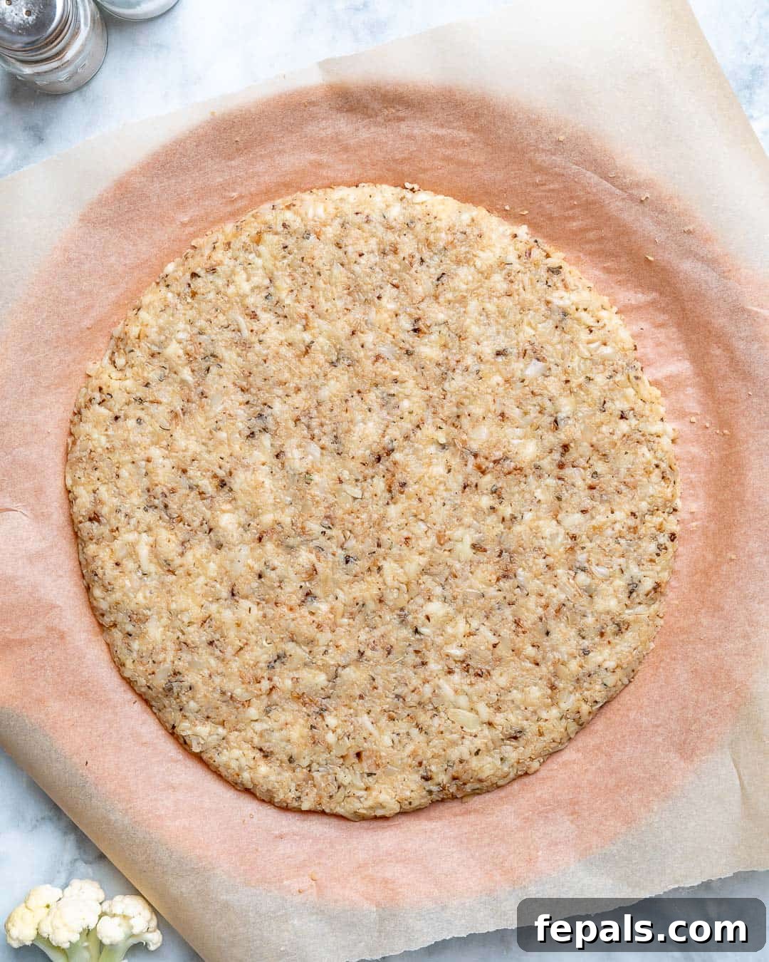 Crispy Cauliflower Pizza Crust 9 Place dough on baking sheet and pat into 13 inch circle.