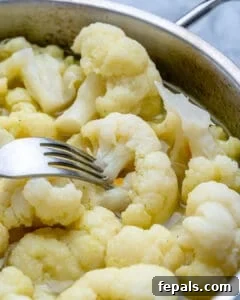 Healthy and Delicious Cauliflower Alfredo Sauce 16 fork in cooked cauliflower to check if its done