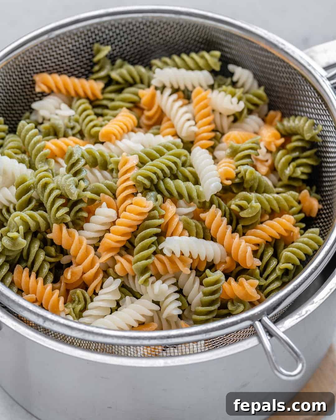 cooked pasta in a colander