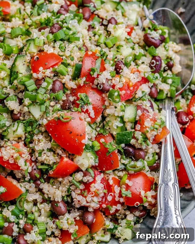 Vibrant Quinoa Black Bean Herb Bowl 8 Close up view of tabbouleh on a plate with spoon in dish