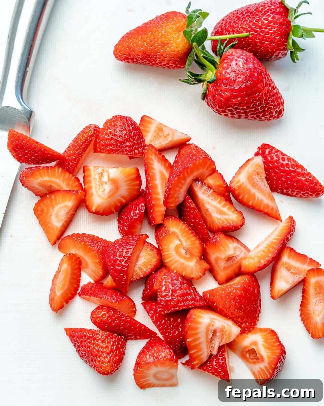 Vibrant Strawberry Chicken Salad 4 chopped strawberries on white surface