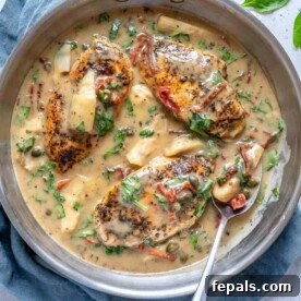 Creamy Tuscan Chicken Delight 9 Top view of creamy chicken in pan, ready to be served, showcasing the rich sauce and tender chicken.