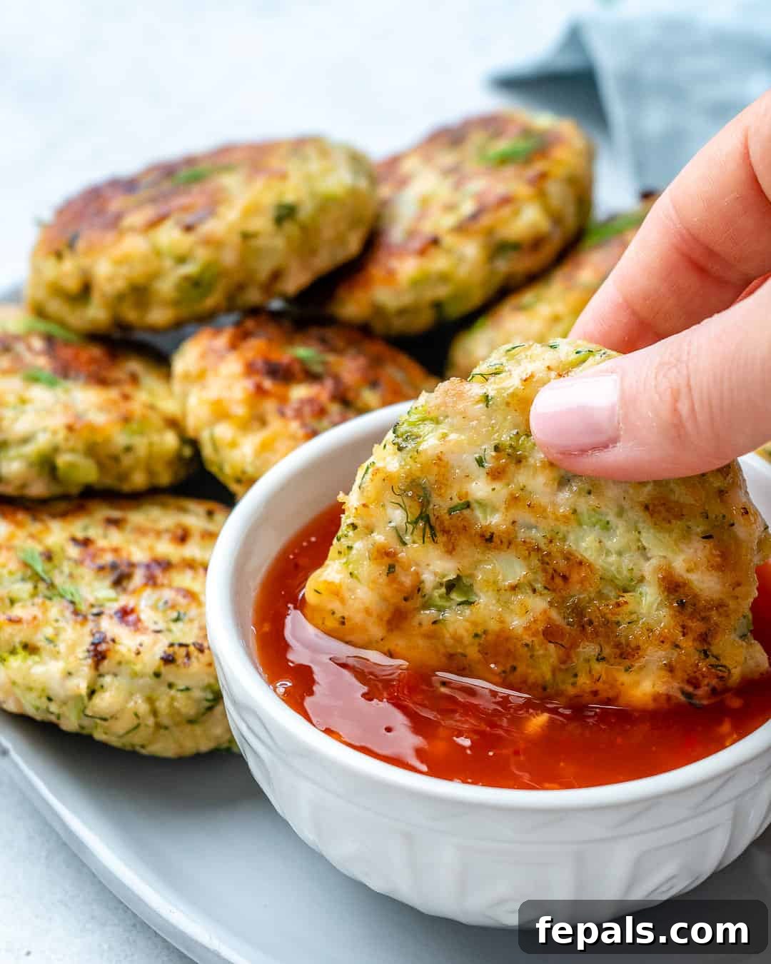 Savory Chicken & Broccoli Bites 4 one fritter dipped in red dipping sauce