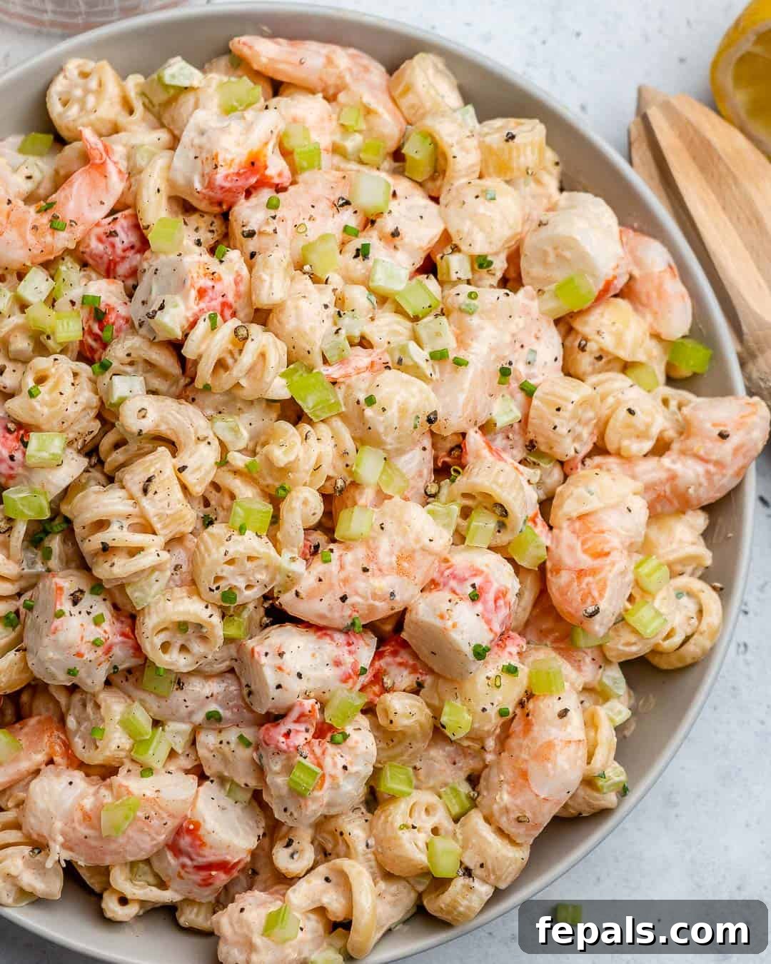 Top view of creamy shrimp pasta salad in a large serving bowl, ready to be enjoyed