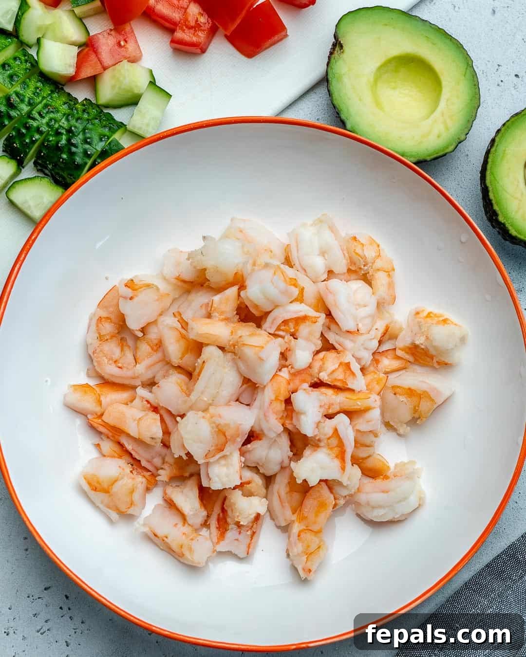 Zesty Shrimp Avocado Salad 5 cut up cooked shrimps on a white plate