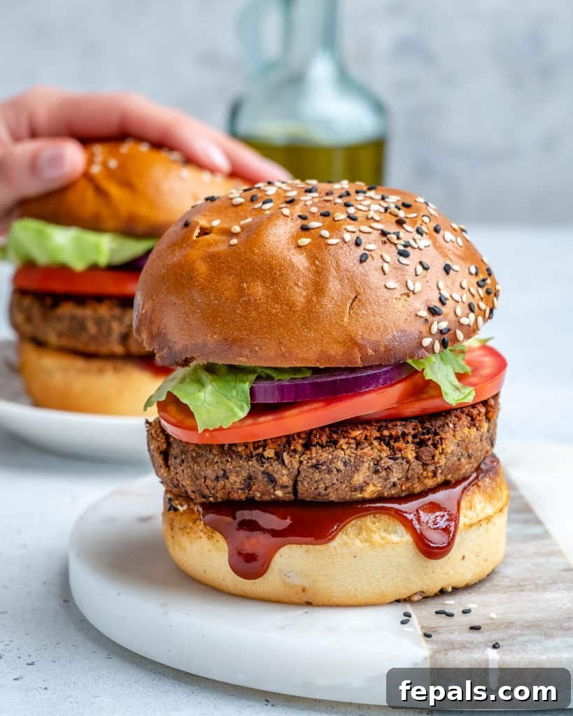 side shot of 2 bean burger assembled on a flat surface
