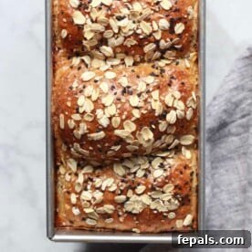 baked wheat bread in a loaf pan.