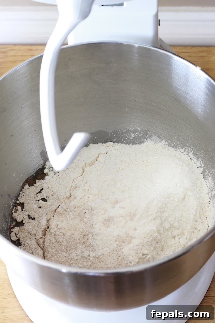 Artisan Whole Wheat Chia Loaf 5 mixing the dough in a bowl with a stand mixer