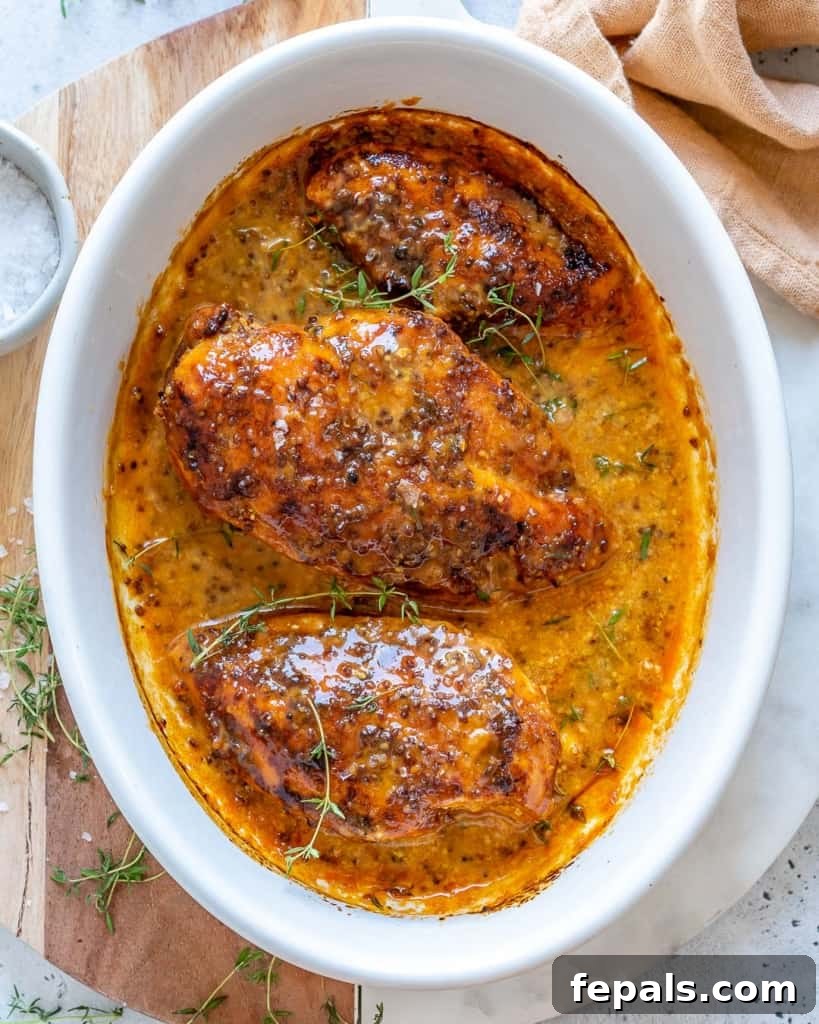 Golden Honey Mustard Chicken 2 top view of 3 baked chicken breast in a white dish