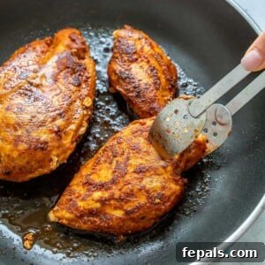 Golden Honey Mustard Chicken 8 Pan-fried seasoned chicken breast on a black skillet
