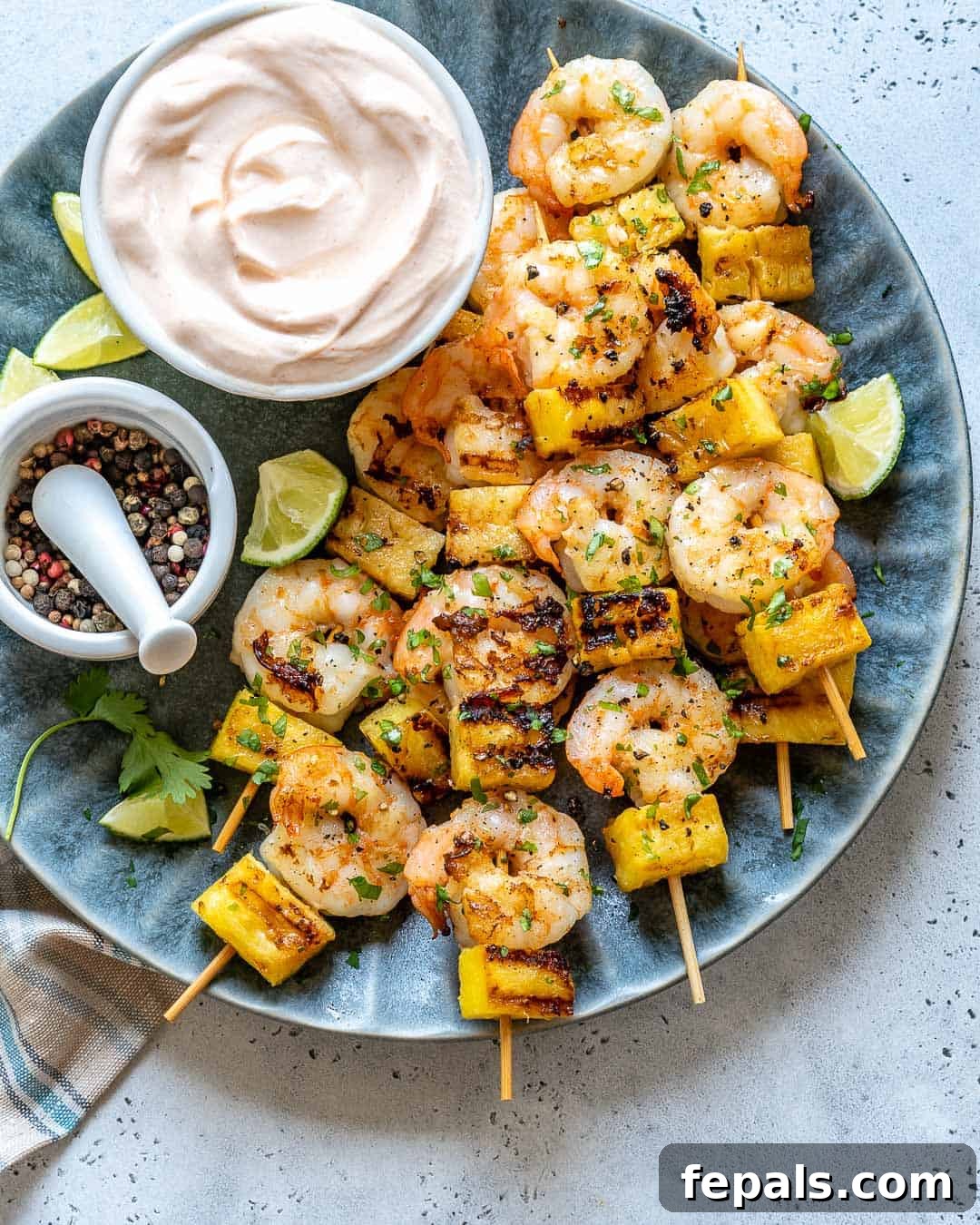 top view grilled shrimp on blue plate 