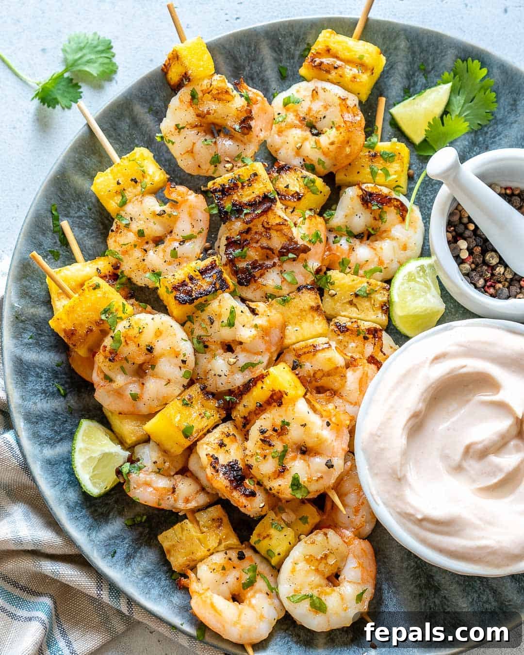 shrimp skewers on blue plate 