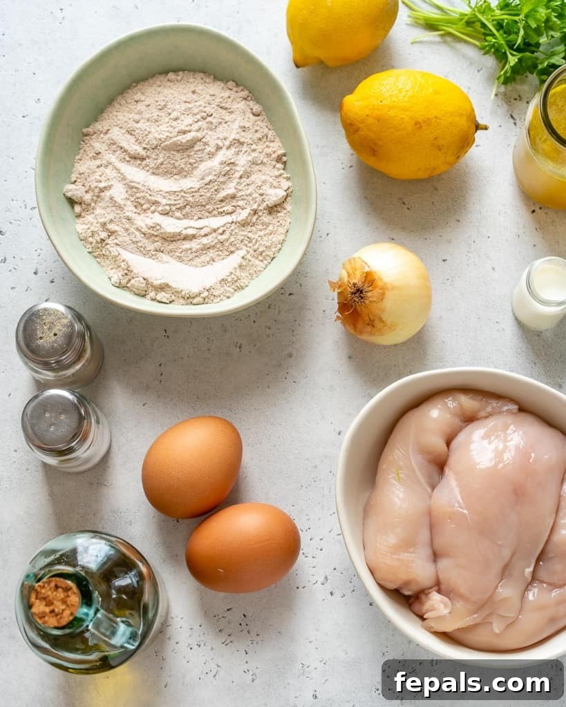 ingredients for chicken francese recipe, including chicken, lemons, flour, eggs, and herbs