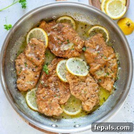 top view chicken in a pan with lemon sauce