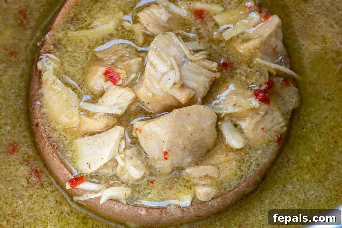 Simple Dairy-Free Instant Pot Chicken Curry 5 Cooked chicken curry bubbling gently in the Instant Pot, looking rich and inviting.
