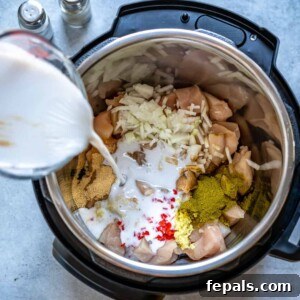 Pouring coconut milk into Instant Pot with other ingredients.