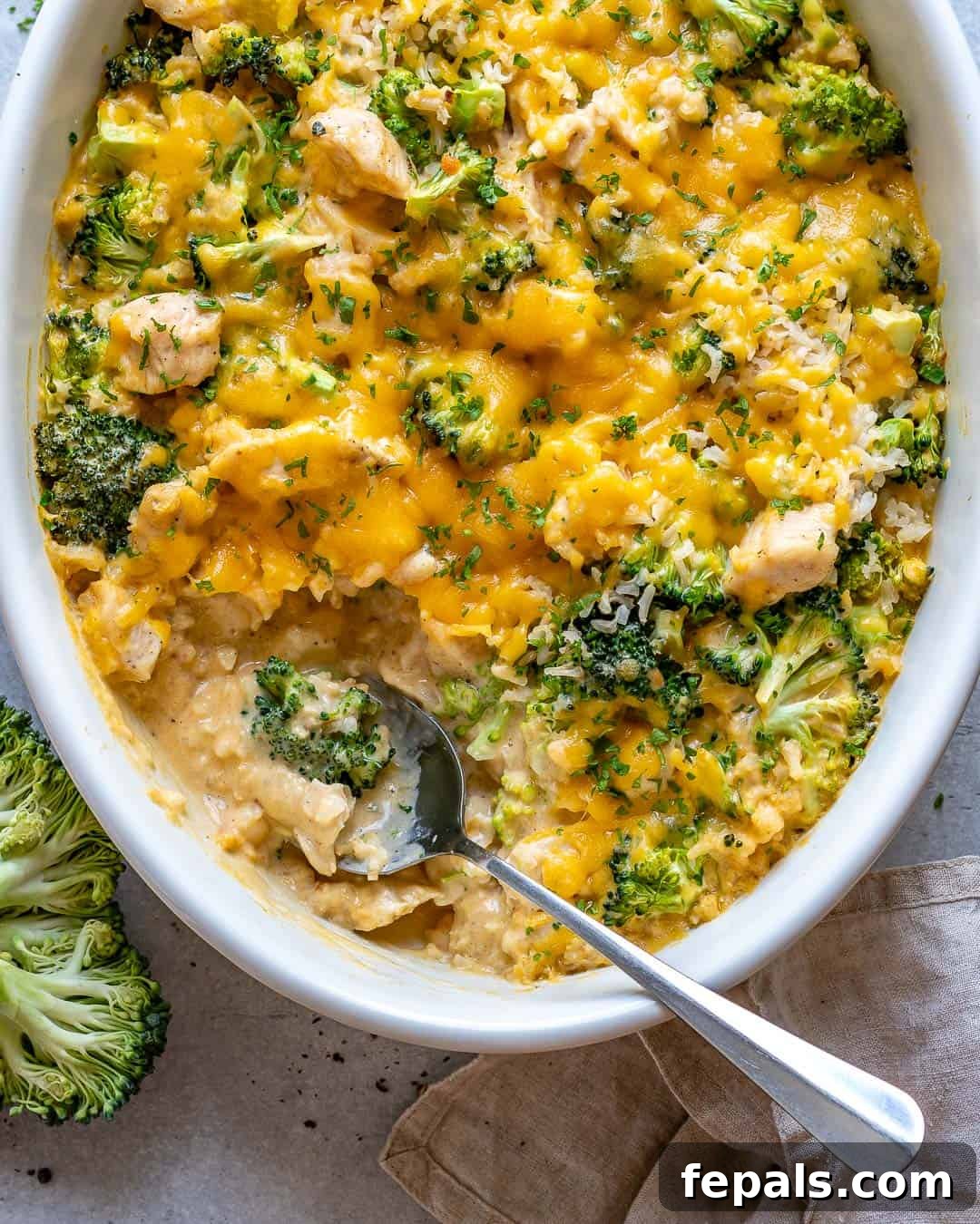 Creamy Chicken Broccoli Rice Bake 9 Spoon in finished chicken & broccoli casserole