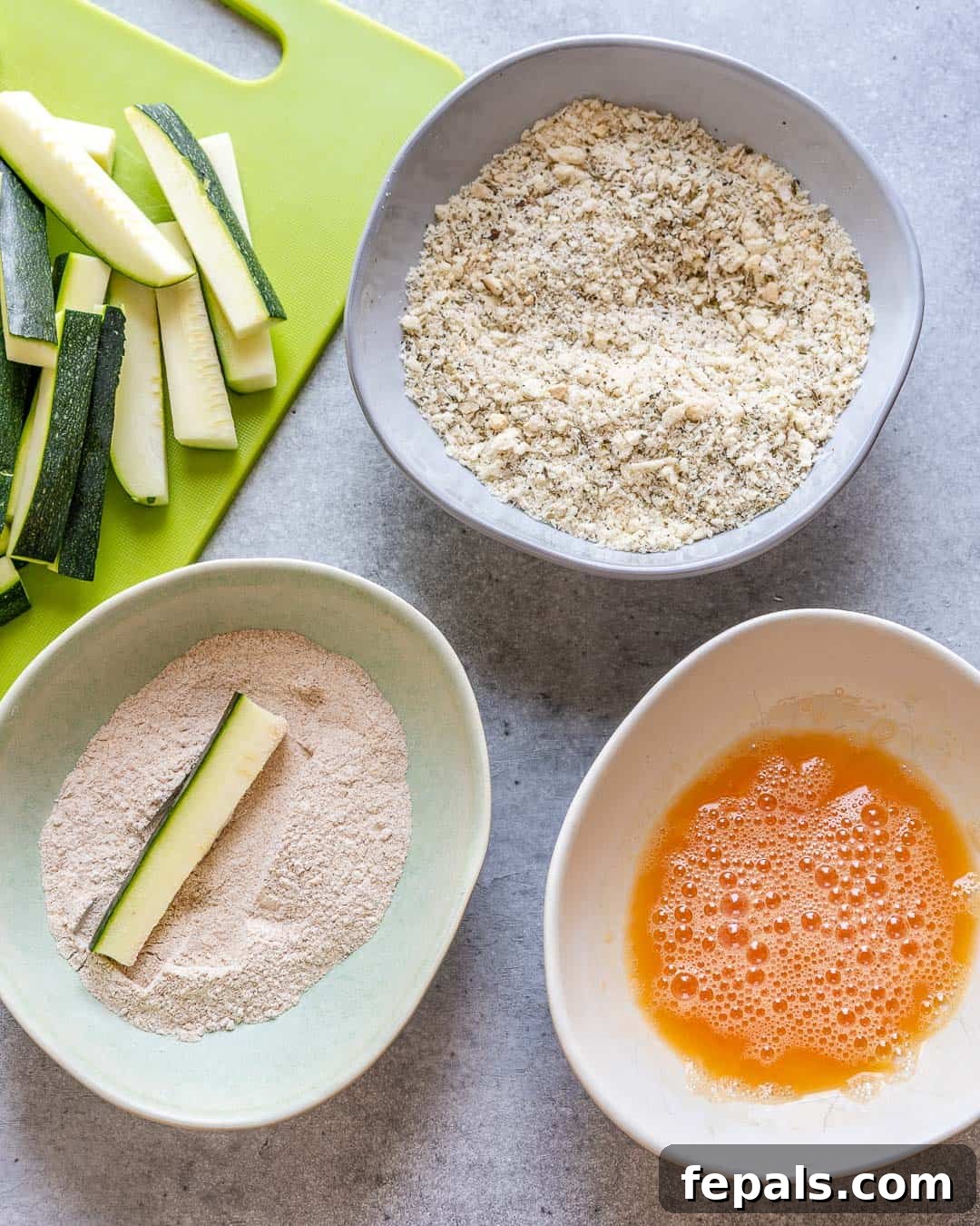 Parmesan-Crusted Zucchini Fries 6 Zucchini dipping process in flour, panko, and eggs