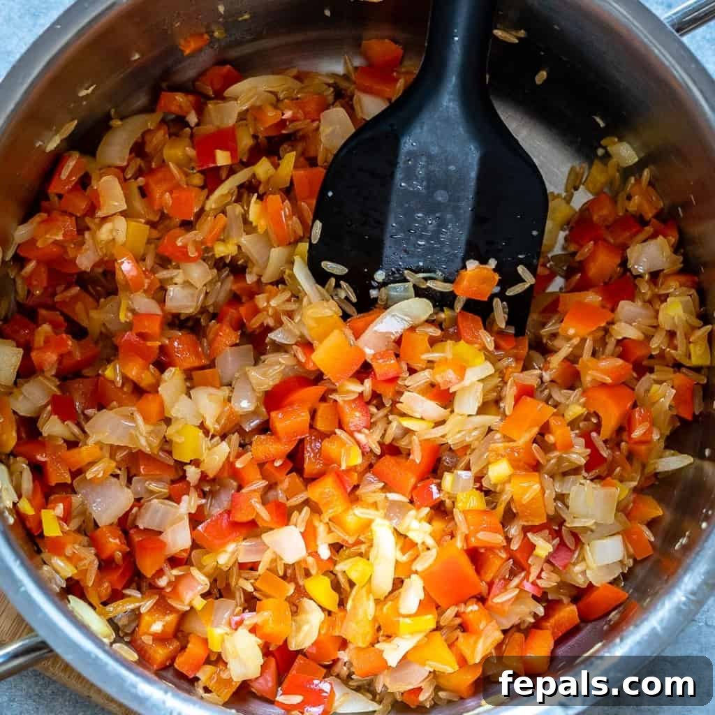 Homestyle Tomato Rice Soup 5 sautéed onions and bell peppers in a pot