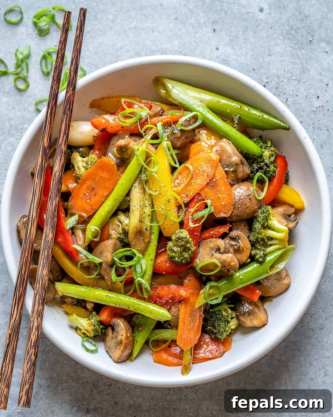 Vibrant Sweet and Sour Vegetable Stir-Fry 2 Colorful vegetable stir fry served in a white bowl, ready to eat.