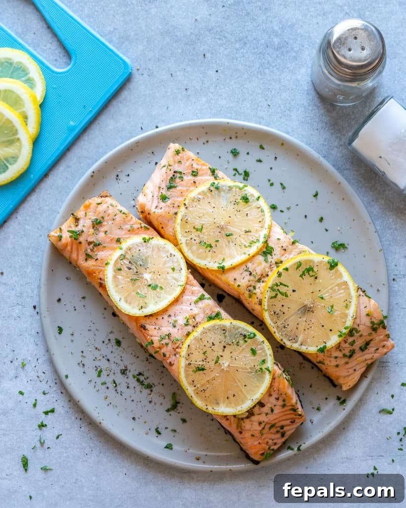 top view baked salmon on a white plate