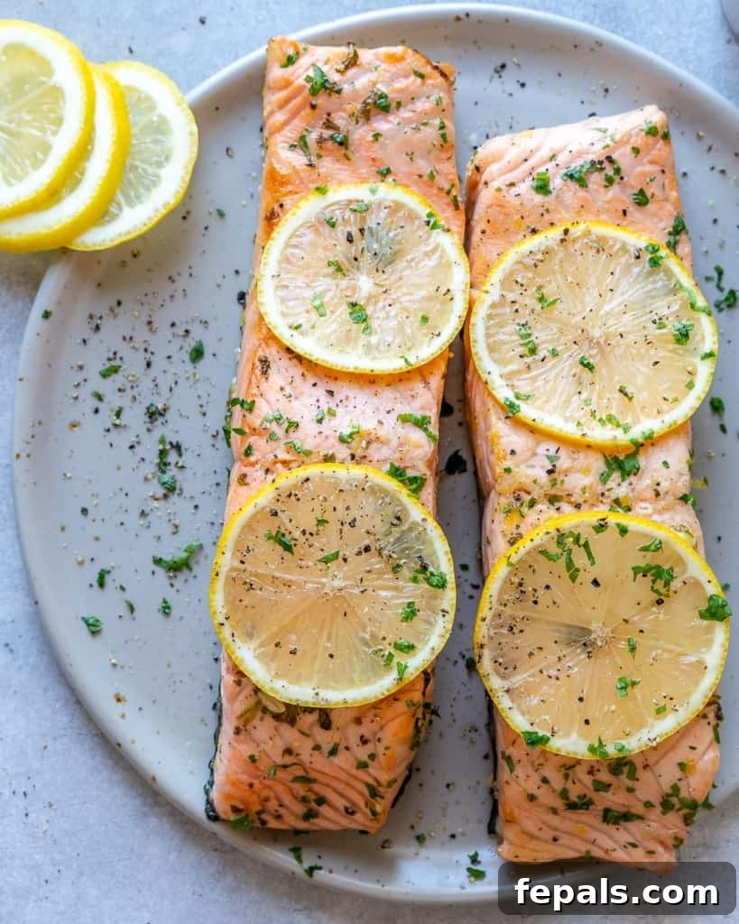top view of two baked salmon filets on a plate
