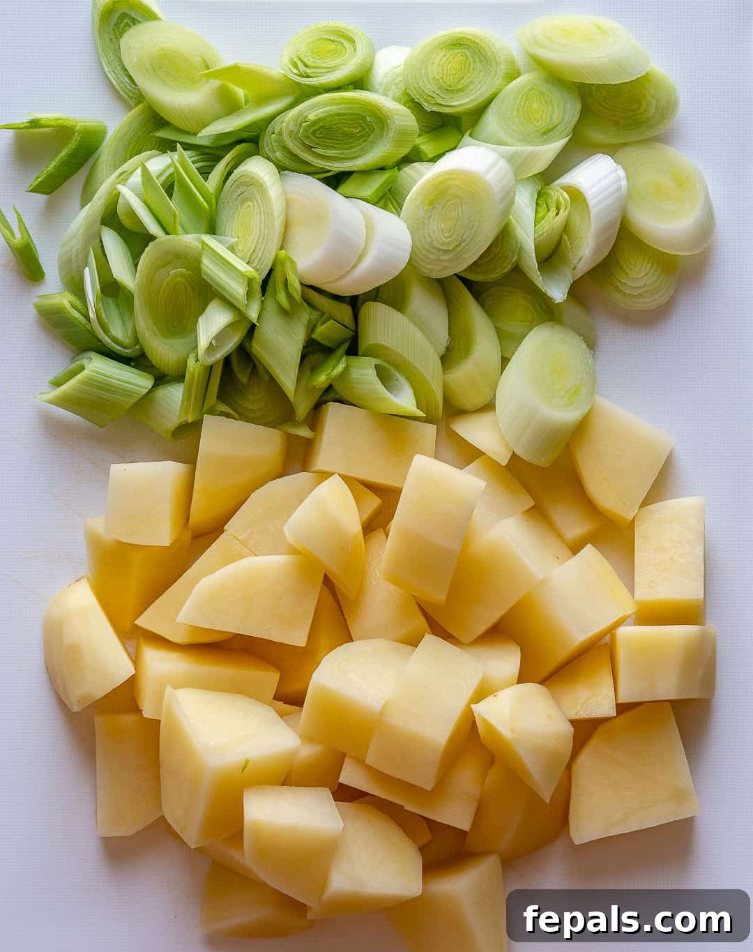 Velvet Asparagus Soup 5 Chopped leeks and potatoes on a cutting board