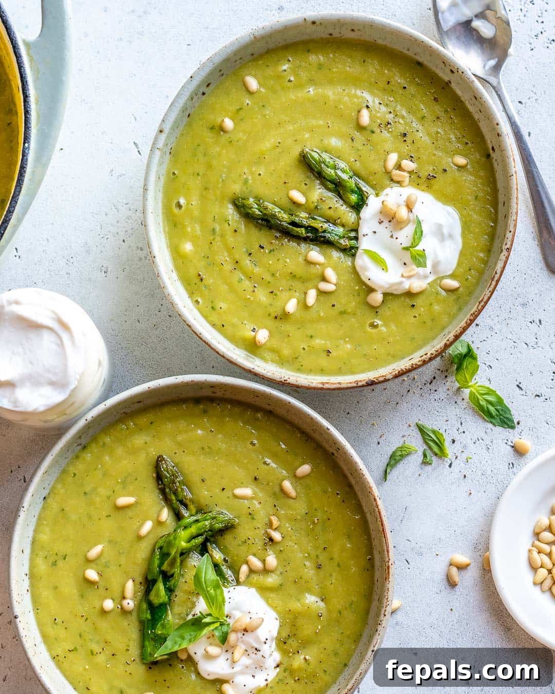 Velvet Asparagus Soup 7 Healthy Asparagus Soup Recipe ladled into two bowls and garnished.