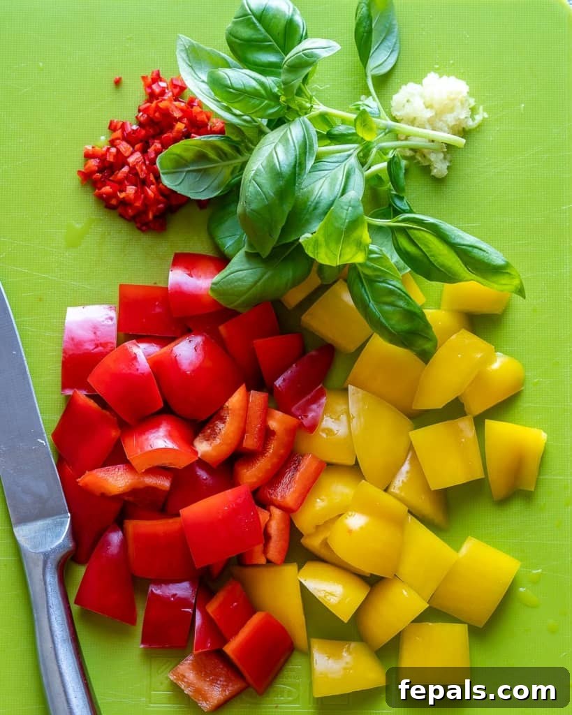 Freshly chopped colorful bell peppers ready for stir-frying.