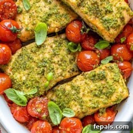 baked salmon and tomatoes in white dish
