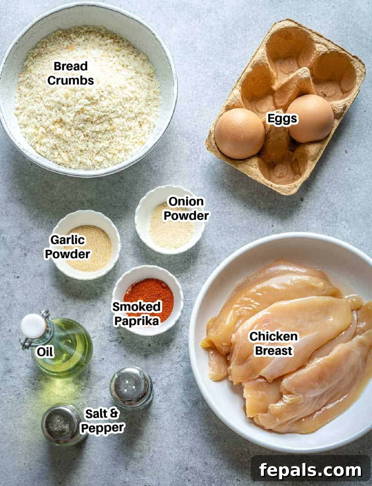 Crispy Air Fryer Chicken Nuggets 4 Ingredients to make air fryer chicken nuggets laid out on a table