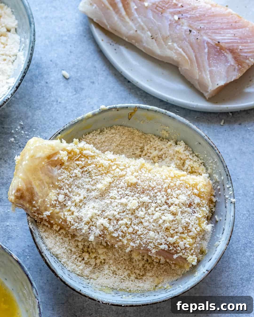 Air Fryer Magic: Crispy Fish and Chips 5 Fish filet coated in flour, egg, and breadcrumbs.