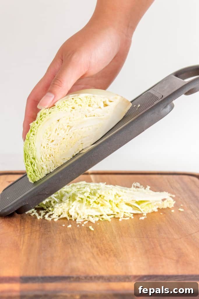 Mastering Cabbage Cuts 12 cabbage being shredded using a mandolin