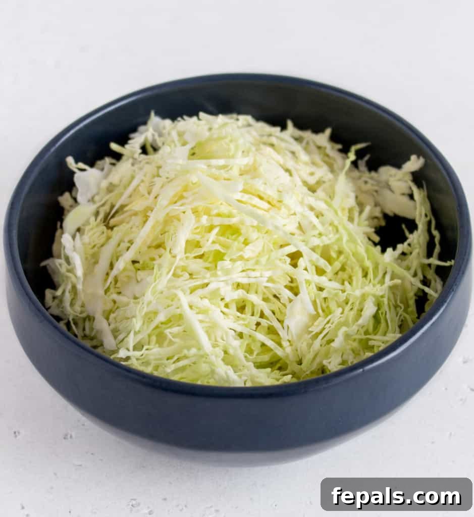 Mastering Cabbage Cuts 3 Shredded white cabbage in black bowl