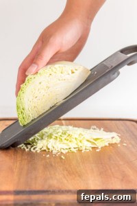 Mastering Cabbage Cuts 25 cabbage being shredded using a mandolin