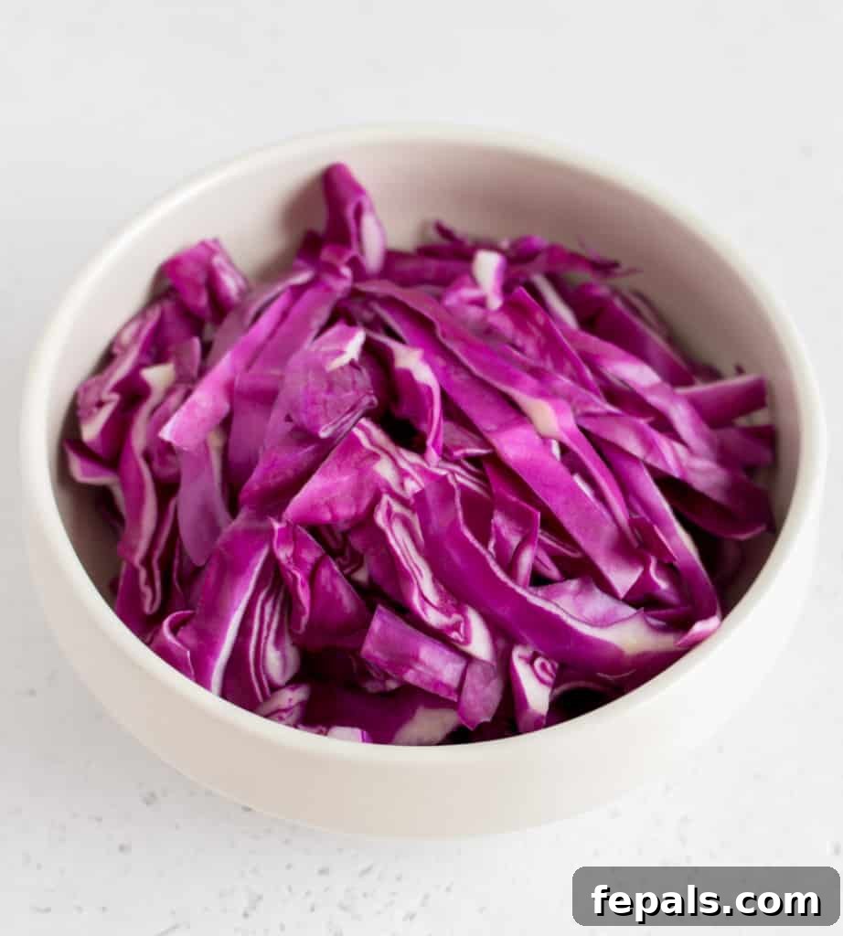 Mastering Cabbage Cuts 4 shredded red cabbage in white bowl