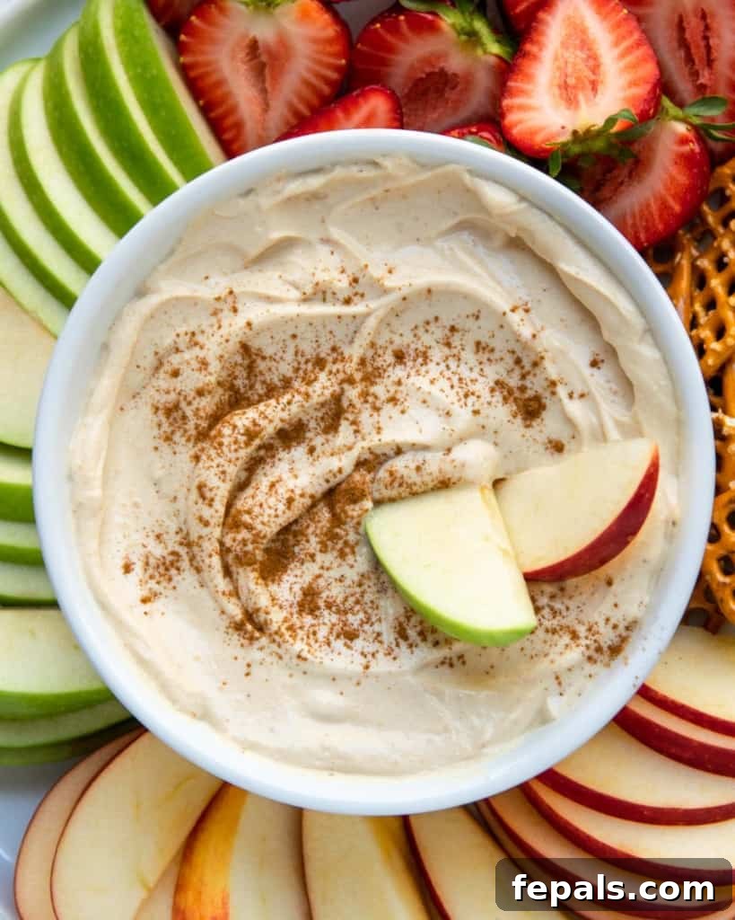 Peanut Butter Bliss Dip 3 top view yogurt dip with two apple slices in dip