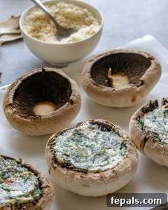 Rustic Tuscan Stuffed Mushrooms 15 Filling up mushrooms with stuffing.
