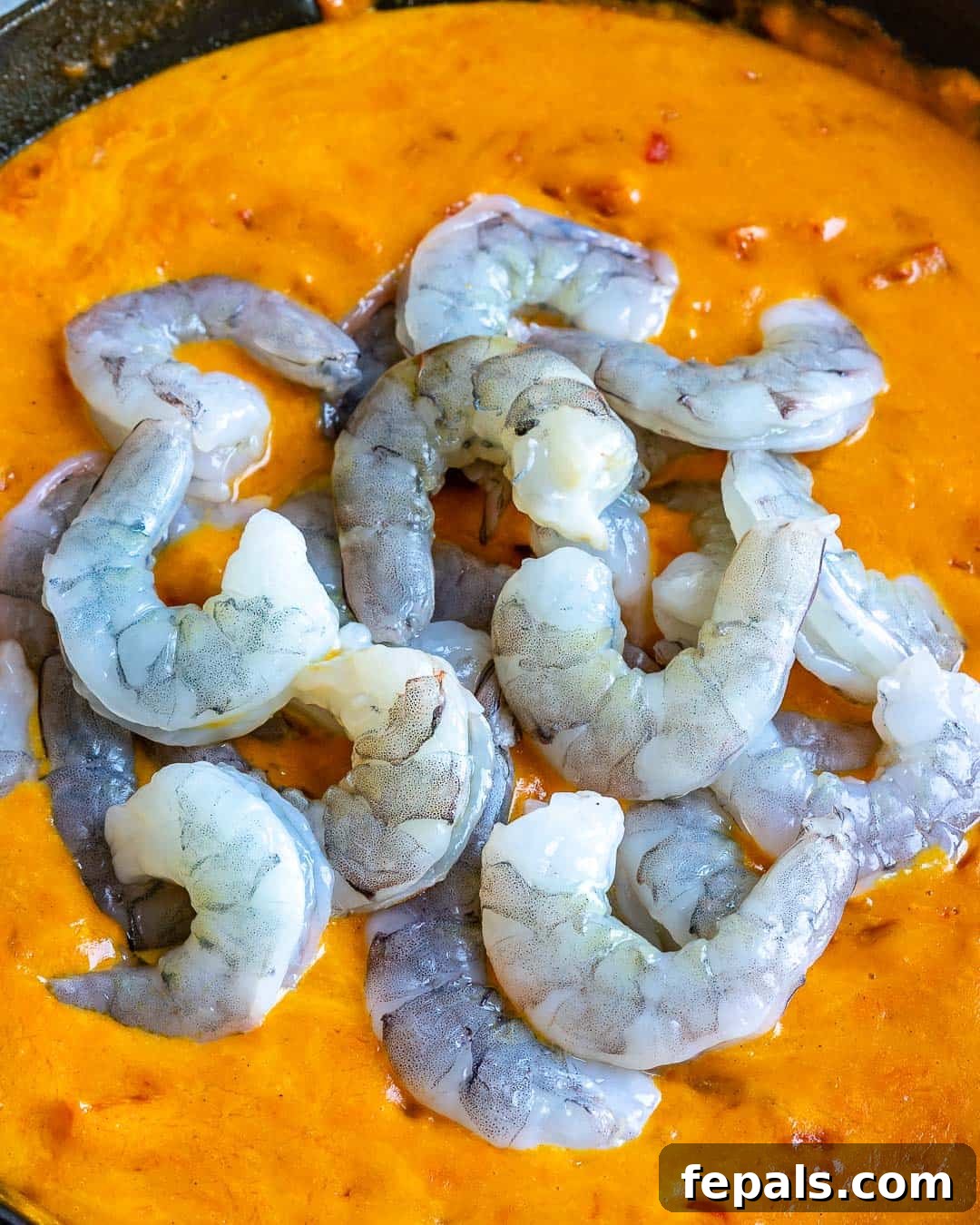Creamy Coconut Shrimp Curry 6 Peeled and deveined shrimp gently simmering in the rich, creamy curry sauce in a pan