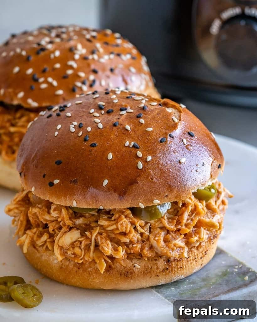 side view of chicken burger on a plate