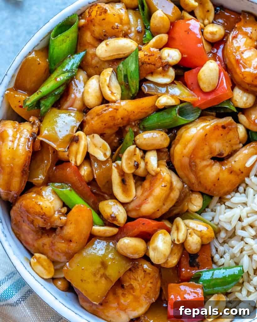 Spicy Szechuan Peanut Shrimp 8 Close view of Kung Pao shrimp in white bowl, highlighting the sauce and texture