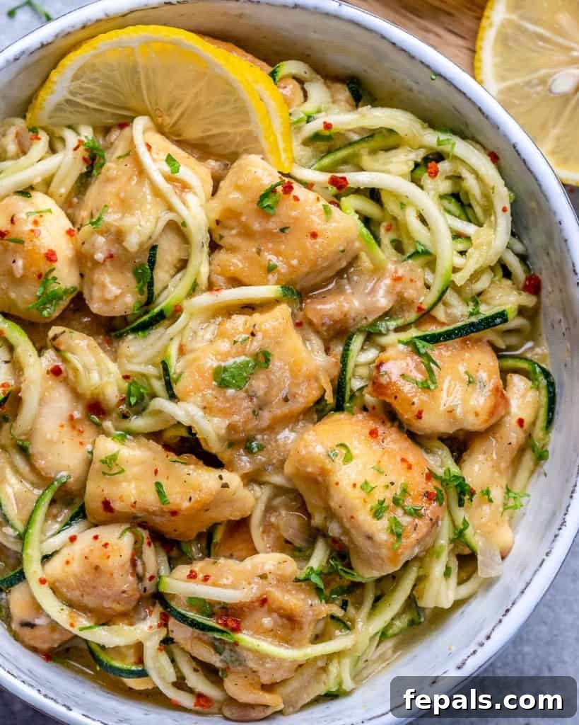 top view of chicken scampi with zoodles in white bowl
