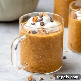 side view of a cup full of pumpkin overnight oats.